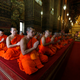 Buddhist monks pray during the coronation.